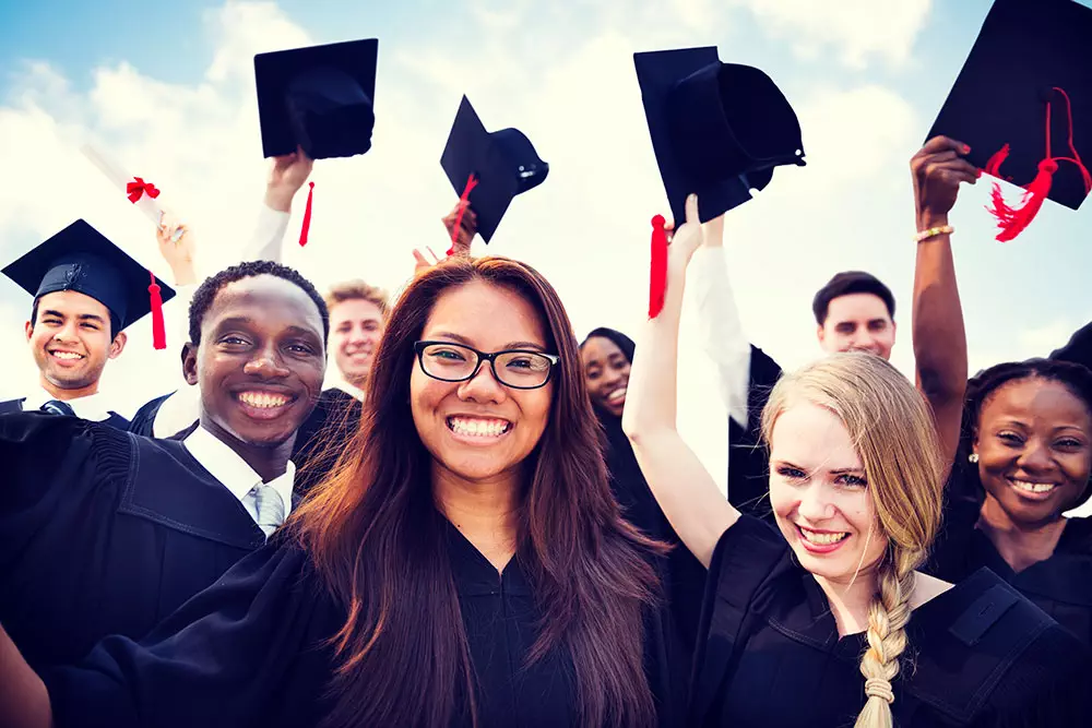 photo of a diverse group of graduation students celebrating in Calgary